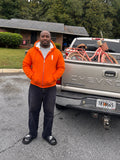 Chad wearing the GHETTO A orange sherpa-lined hoodie