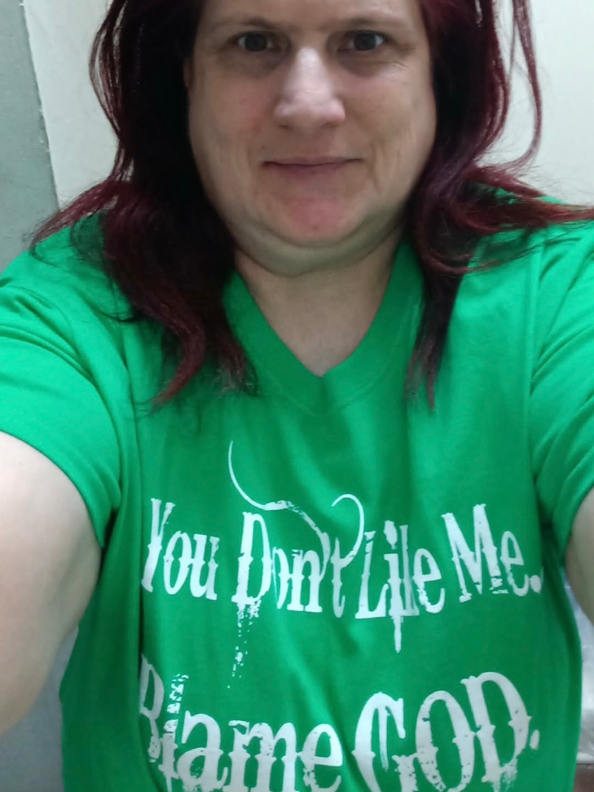 Woman wearing the Blame GOD tee