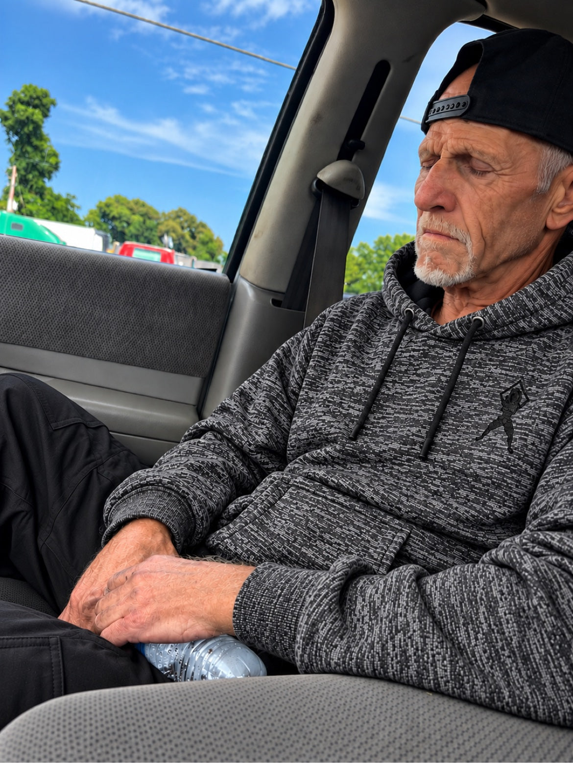 Man wearing the GHETTO A grey heather embroidered hoodie