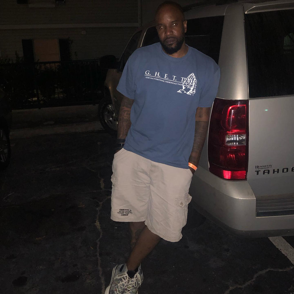 Man wearing the G.H.E.T.T.O. Praying Hands tee
