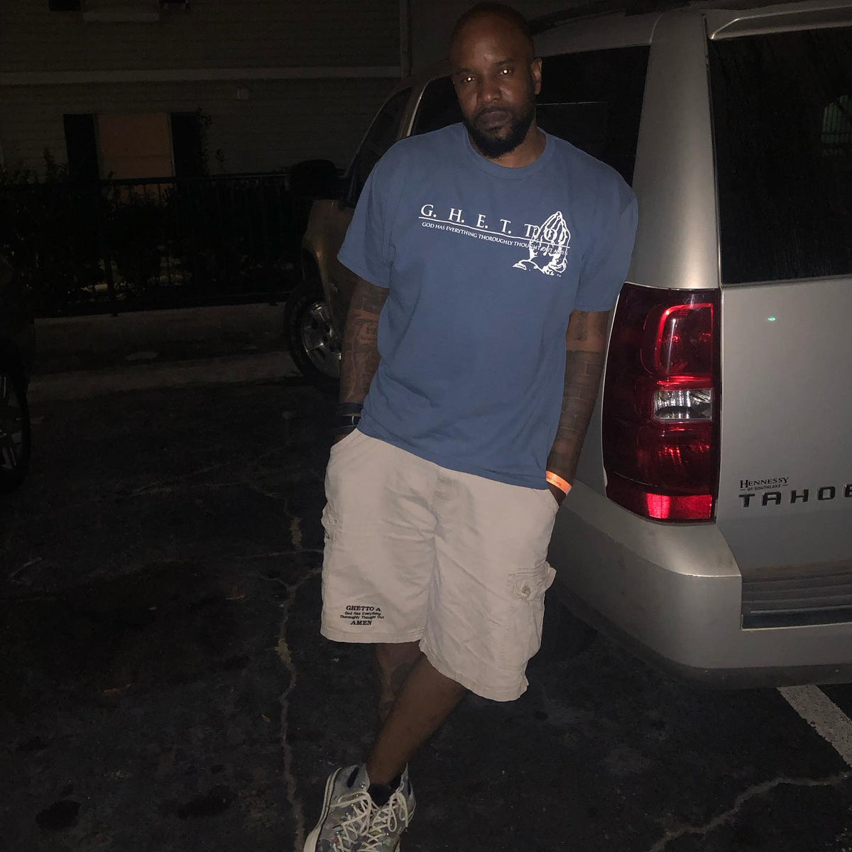 Man wearing the G.H.E.T.T.O. Praying Hands tee